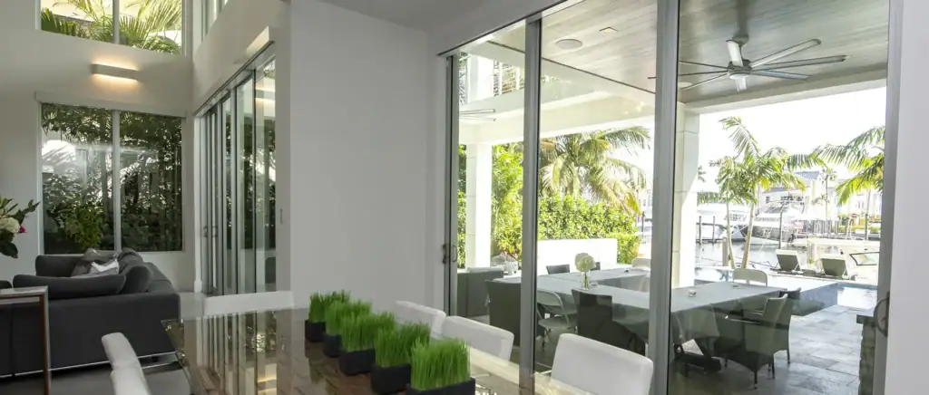 large windows on white walls overlooking sunny landscape