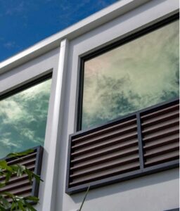 casement windows with clouds reflecting in them