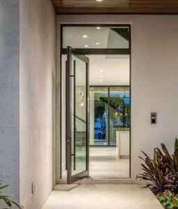 pivot front door looking into luxury home